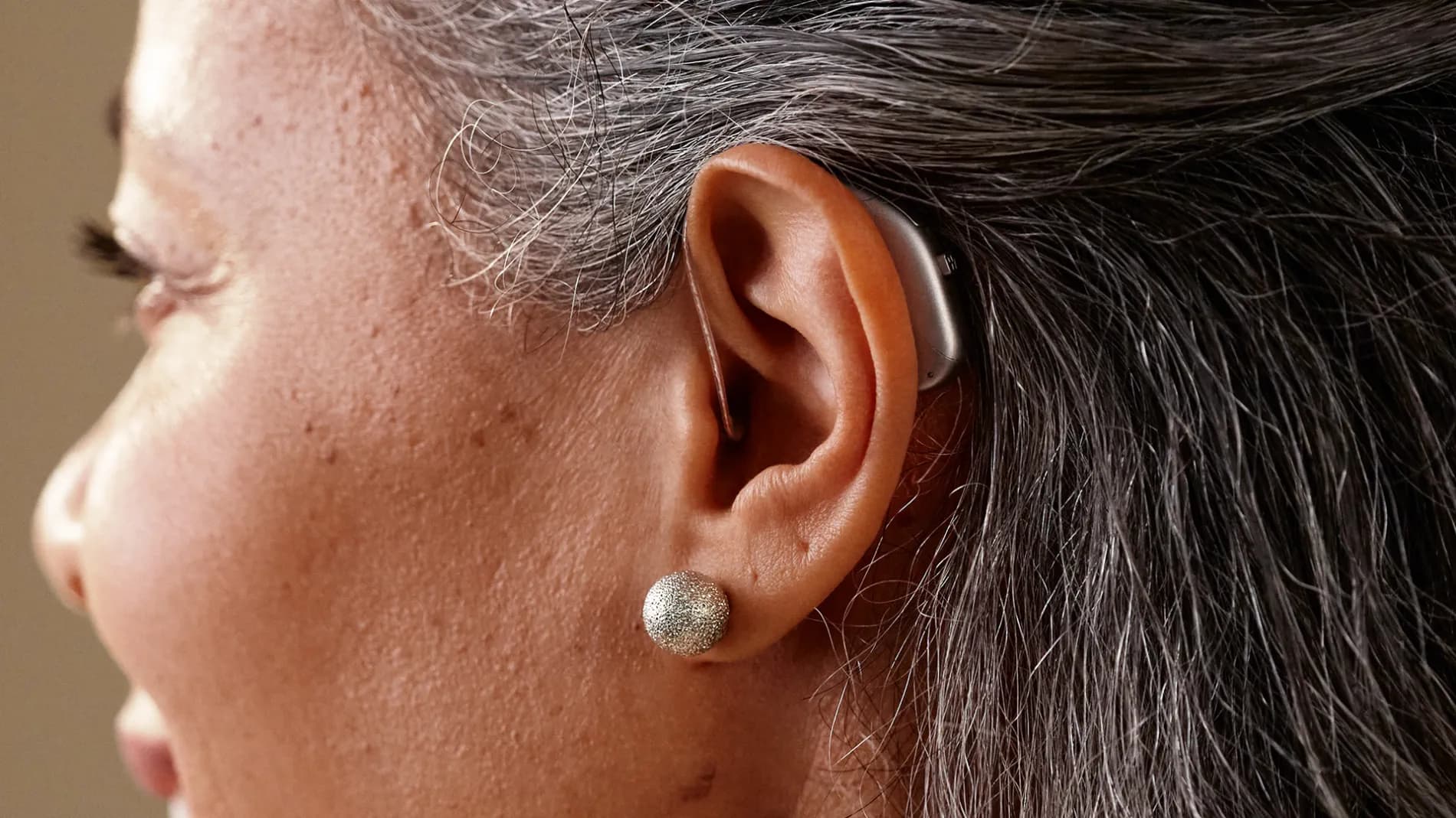 Person wearing a Widex Allure hearing aid